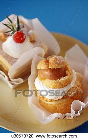 Stock Image - Cream puff and cake. Fotosearch