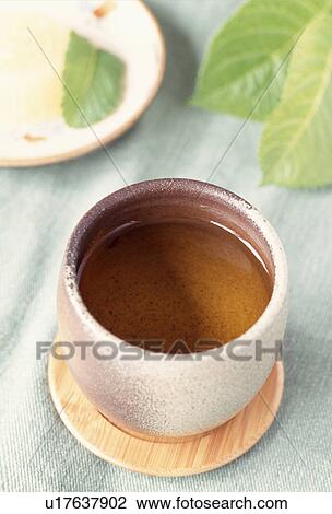 Stock Image - Cup of green tea. Fotosearch