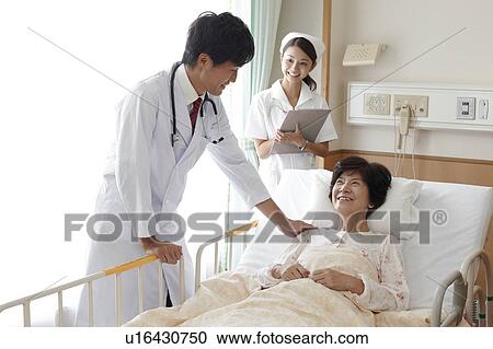 Doctor and Nurse with Patient View Large Photo Image Stock Image - Doctor and Nurse with Patient. Fotosearch
