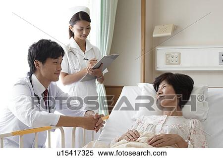 Doctor and Nurse with Patient View Large Photo Image Stock Photography - Doctor and Nurse with Patient. Fotosearch