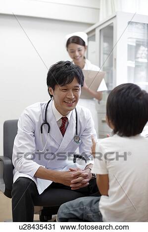 Stock Image - Doctor Examining Boy. Fotosearch