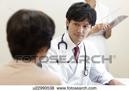 Doctor Listening to Patient View Large Photo Image Stock Photo - Doctor Listening to Patient. Fotosearch