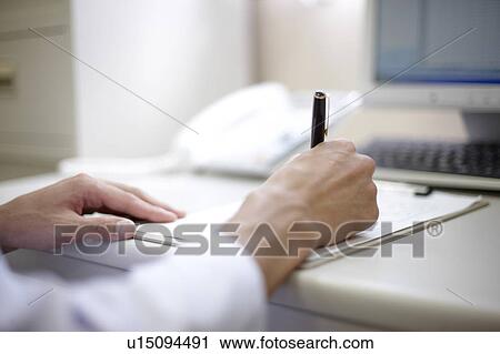 Stock Image - Doctor Writing. Fotosearch