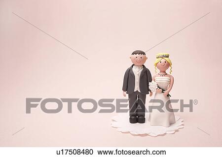 Stock Image - Figurine of bride and groom. Fotosearch
