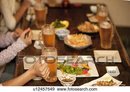 Friends at a bar View Large Photo Image Stock Photo - Friends at a bar. Fotosearch