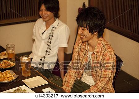 Friends at a bar View Large Photo Image Stock Photo - Friends at a bar. Fotosearch