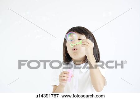 Girl Blowing Bubbles View Large Photo Image Stock Photo - Girl Blowing Bubbles. Fotosearch