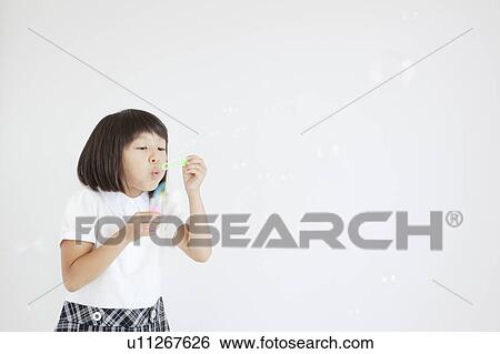 Girl Blowing Bubbles View Large Photo Image Stock Photograph - Girl Blowing Bubbles. Fotosearch