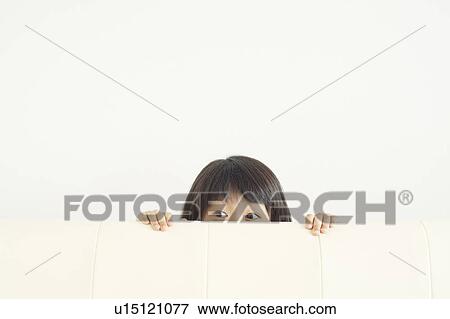 Girl Hiding Behind Sofa View Large Photo Image Stock Photo - Girl Hiding Behind Sofa. Fotosearch