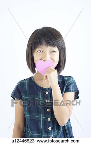 Stock Image - Girl Holding Love Heart. Fotosearch