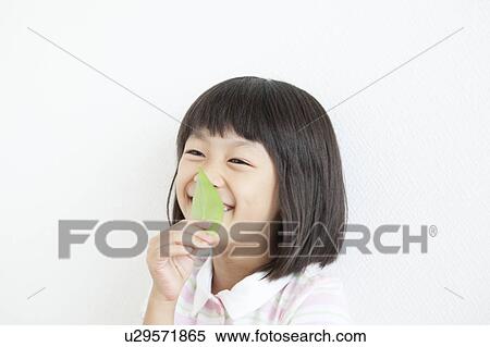 Stock Photography - Girl with Leaf. Fotosearch