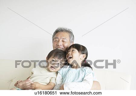 Granddaughter and Grandson Sitting on Grandfather's Lap View Large Photo Image Stock Image - Granddaughter and Grandson Sitting on Grandfather's Lap. Fotosearch