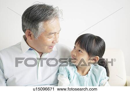 Stock Image - Grandfather and Granddaughter. Fotosearch
