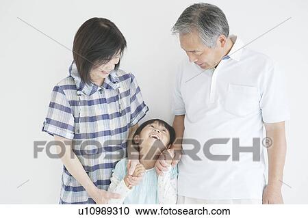 Grandparents and granddaughter holding hands View Large Photo Image Stock Image - Grandparents and granddaughter holding hands. Fotosearch
