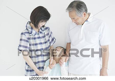 Grandparents and granddaughter holding hands View Large Photo Image Stock Photograph - Grandparents and granddaughter holding hands. Fotosearch