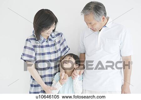Grandparents and granddaughter holding hands View Large Photo Image Stock Photography - Grandparents and granddaughter holding hands. Fotosearch