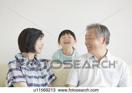 Stock Image - Grandparents and Granddaughter. Fotosearch