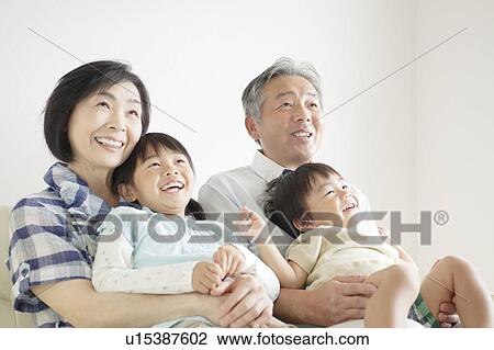 Stock Image - Grandparents and Two Grandchildren. Fotosearch