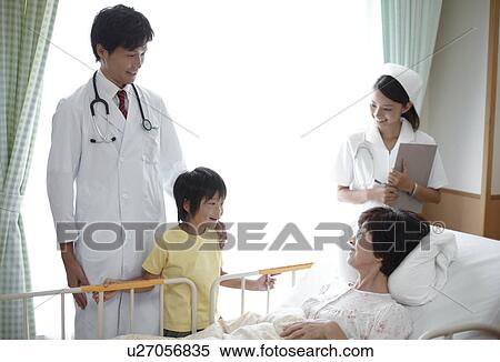 Stock Photography - Grandson Visiting Grandmother in Hospital. Fotosearch