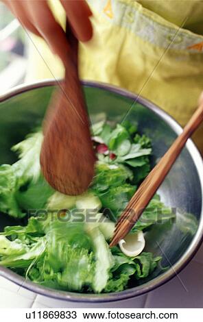 Hand tossing salad View Large Photo Image Stock Image - Hand tossing salad. Fotosearch