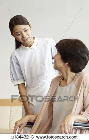 Healthcare Worker and Patient in Wheelchair View Large Photo Image Stock Image - Healthcare Worker and Patient in Wheelchair. Fotosearch