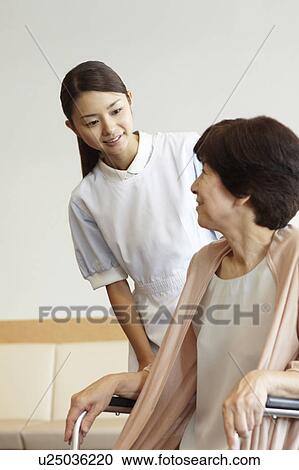 Healthcare Worker and Patient in Wheelchair View Large Photo Image Stock Image - Healthcare Worker and Patient in Wheelchair. Fotosearch