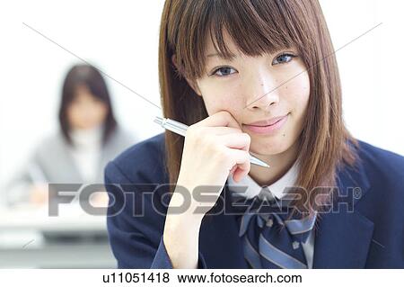 Stock Photo - High school girl looking at camera. Fotosearch