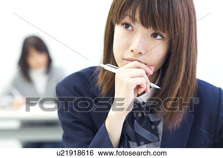 Stock Photograph - High school girl studying at school. Fotosearch