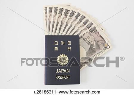 Stock Image - Japanese Passport and Money. Fotosearch
