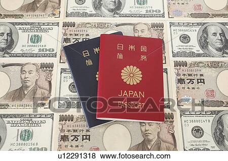 Stock Photo - Japanese Passports on Japanese Paper Notes. Fotosearch