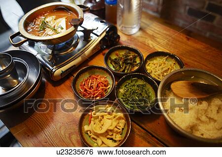 Stock Photograph - Kimchichige (fermented cabbage) nabe and ingredients of bibimbap, Seoul, South Korea. Fotosearch