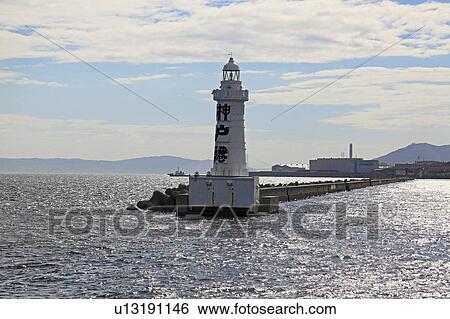 Stock Photograph - Lighthouse at Kobe harbor, Hyogo Prefecture, Honshu, Japan. Fotosearch