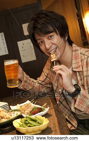 Man at a bar View Large Photo Image Stock Image - Man at a bar. Fotosearch