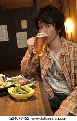 Man at a bar View Large Photo Image Stock Image - Man at a bar. Fotosearch