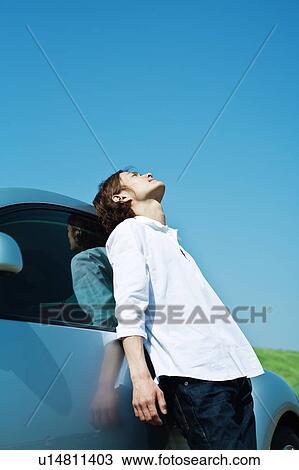 Man Leaning Against His Car and Looking Up View Large Photo Image Stock Image - Man Leaning Against His Car and Looking Up. Fotosearch