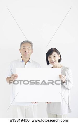 Mature Couple Holding Blank Message View Large Photo Image Stock Image - Mature Couple Holding Blank Message. Fotosearch