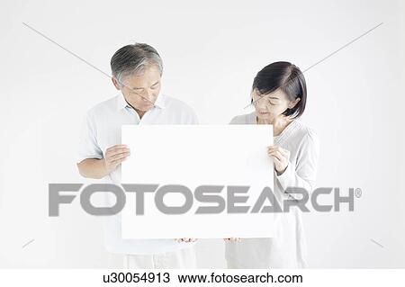 Mature Couple Holding Blank Message View Large Photo Image Stock Image - Mature Couple Holding Blank Message. Fotosearch