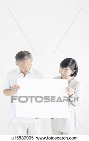 Mature Couple Holding Blank Message View Large Photo Image Stock Photography - Mature Couple Holding Blank Message. Fotosearch