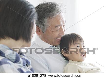 Stock Photo - Mature Couple with Grandson. Fotosearch