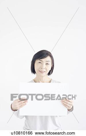 Stock Photograph - Mature Woman with Blank Message. Fotosearch