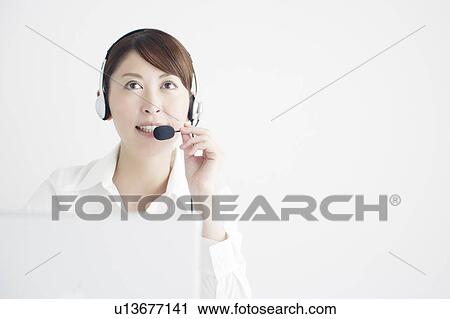 Mid Adult Businesswoman on Internet Telephone View Large Photo Image Stock Image - Mid Adult Businesswoman on Internet Telephone. Fotosearch