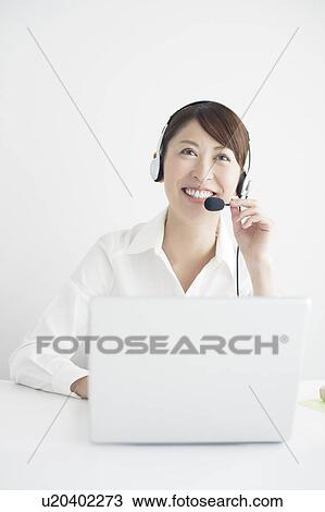 Mid Adult Businesswoman on Internet Telephone View Large Photo Image Stock Image - Mid Adult Businesswoman on Internet Telephone. Fotosearch