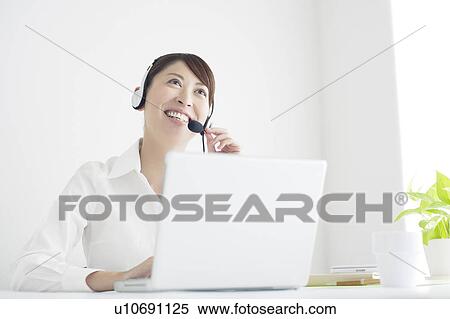Mid Adult Businesswoman on Internet Telephone View Large Photo Image Stock Photography - Mid Adult Businesswoman on Internet Telephone. Fotosearch