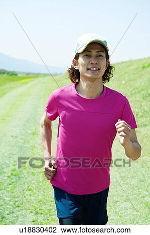 Stock Image - Mid Adult Man Jogging. Fotosearch