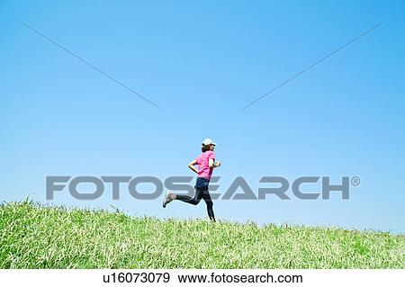 Stock Photo - Mid Adult Man Jogging. Fotosearch
