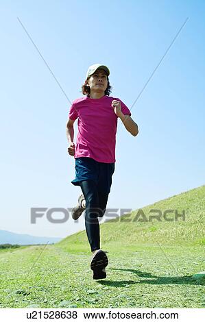 Stock Photo - Mid Adult Man Jogging. Fotosearch