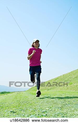 Mid Adult Man Jogging View Large Photo Image Stock Photograph - Mid Adult Man Jogging. Fotosearch