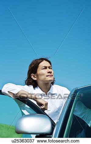 Mid Adult Man Leaning Against Car Door View Large Photo Image Stock Photo - Mid Adult Man Leaning Against Car Door. Fotosearch
