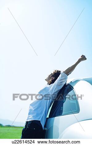 Mid Adult Man Leaning Against Car View Large Photo Image Picture - Mid Adult Man Leaning Against Car. Fotosearch
