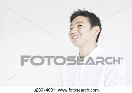 Mid adult man smiling View Large Photo Image Stock Photo - Mid adult man smiling. Fotosearch